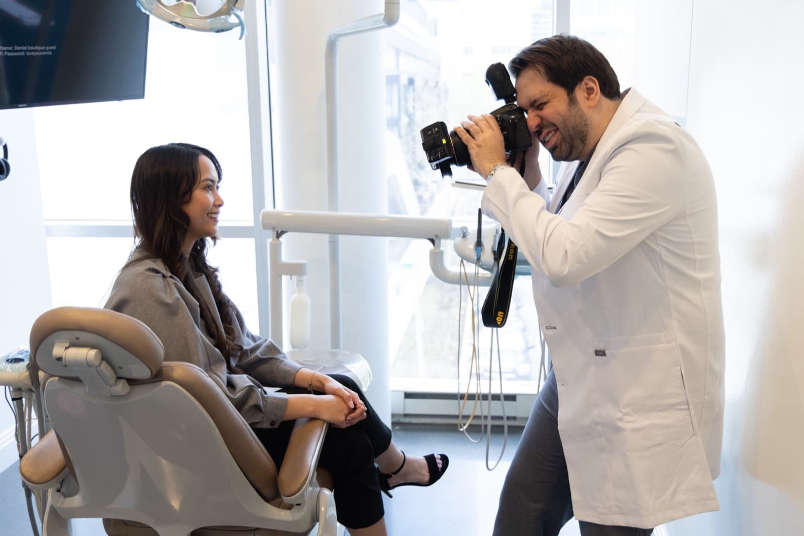 Dr. Atassi photographing a patient's smile