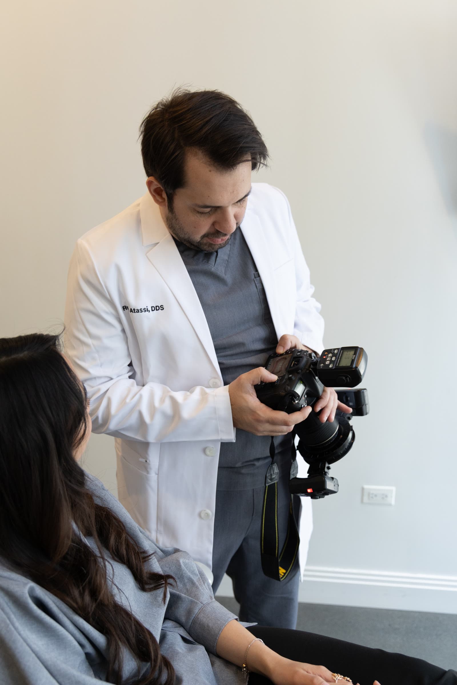 Dr. Atassi reviewing photographs on the camera