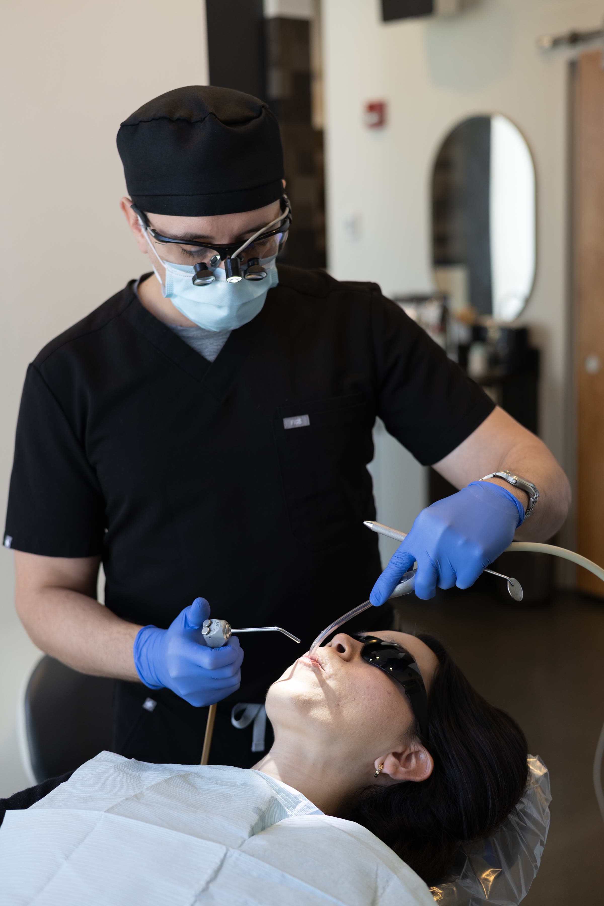 Dr. Atassi at work under loupes